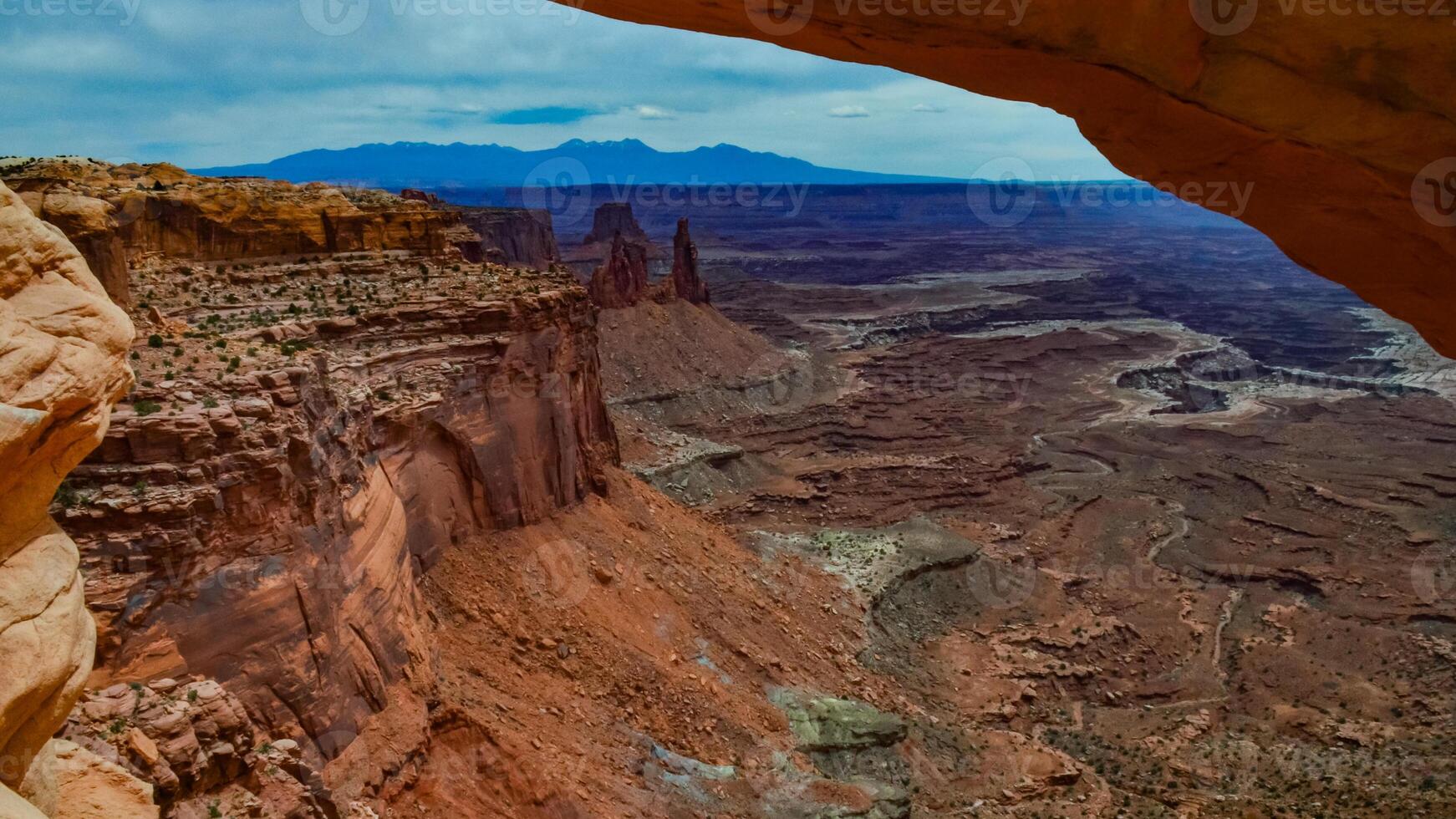 View from Mesa Arch in Canyonlands National Park near Moab, Utah, US photo