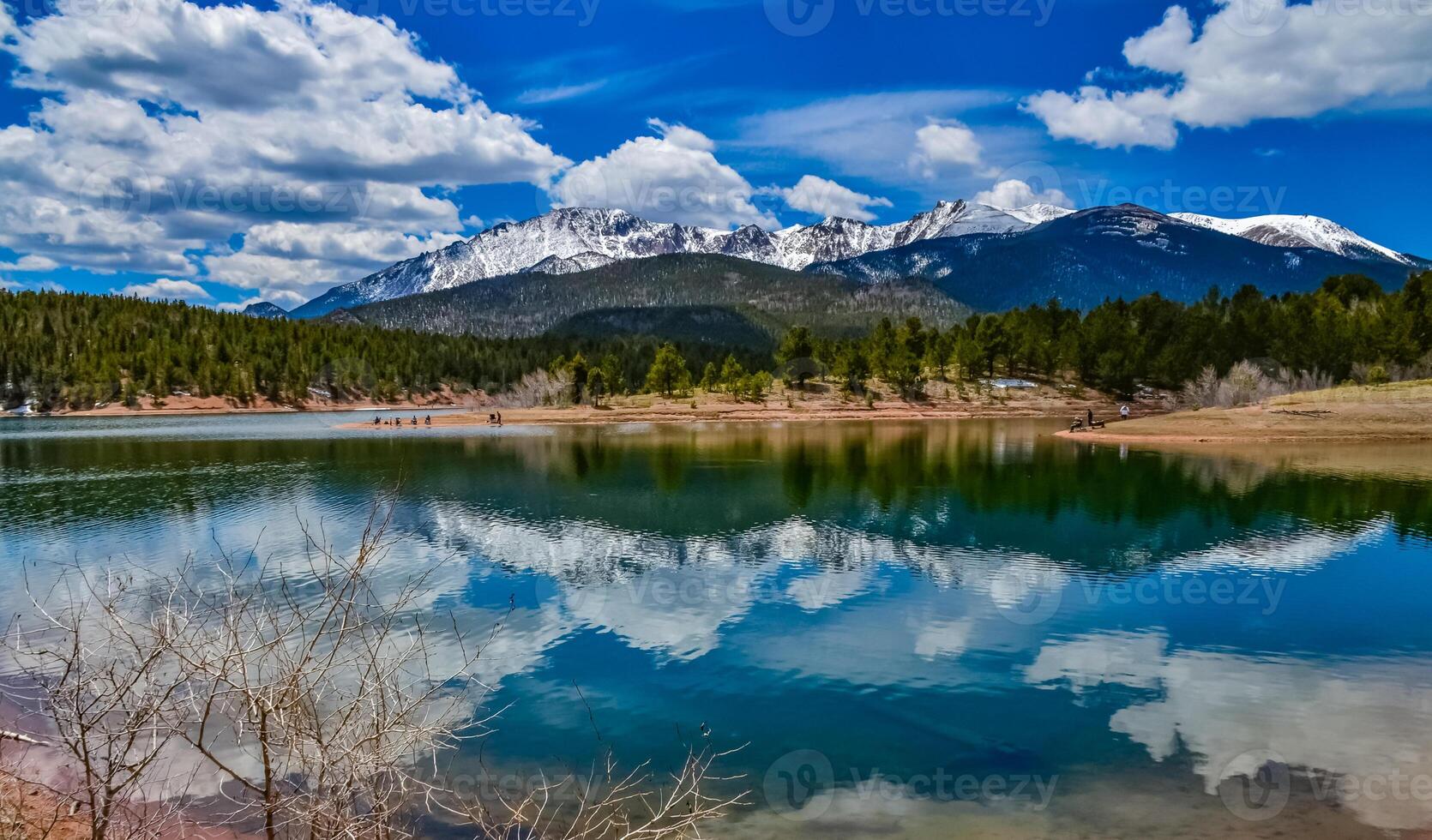Panorama Snow-capped and forested mountains near a mountain lake, Pikes Peak Mountains in Colorado Spring, Colorado, US photo