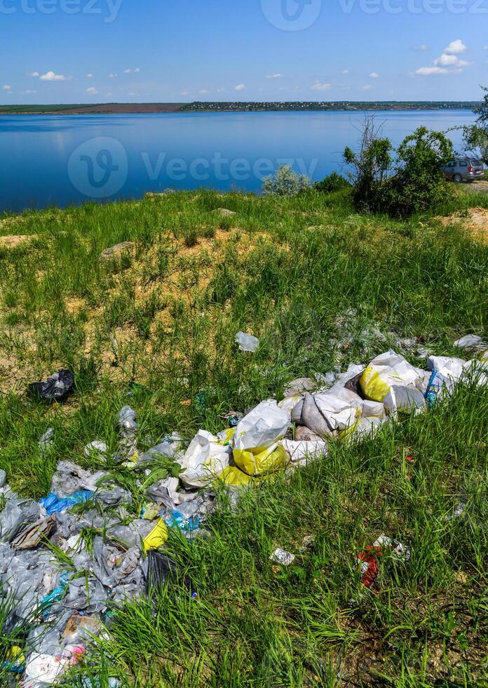 Environmental problem, pollution of the shores of a reservoir with construction and plastic waste, Khadzhibey estuary photo