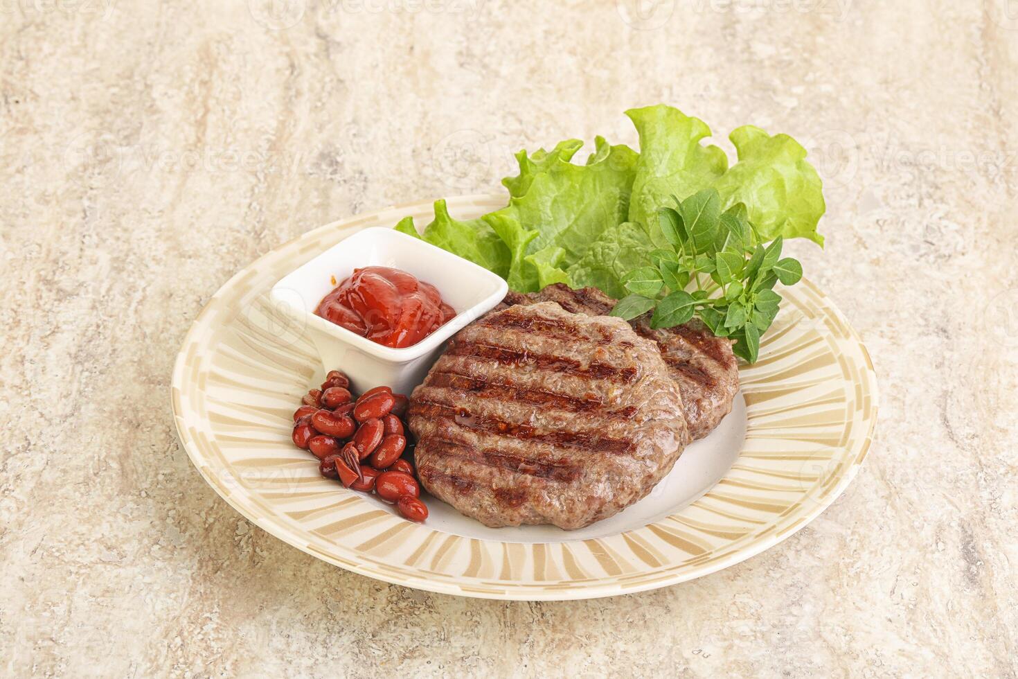 Grilled beef burger cutlet with sauce photo