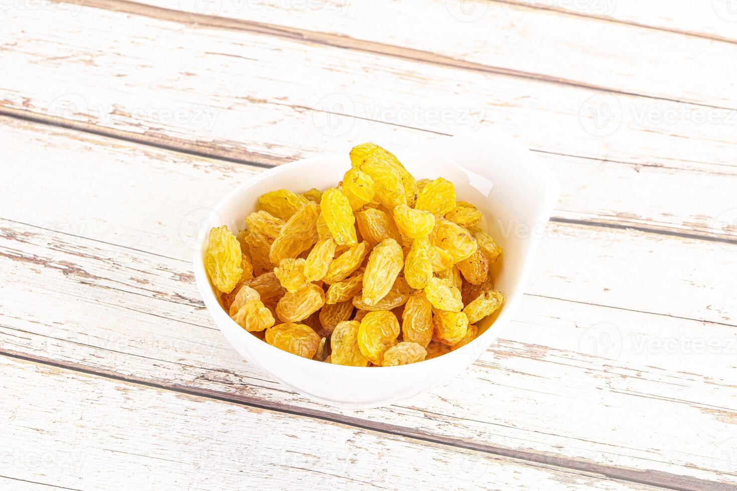 Yellow raisin - dry grape berries photo