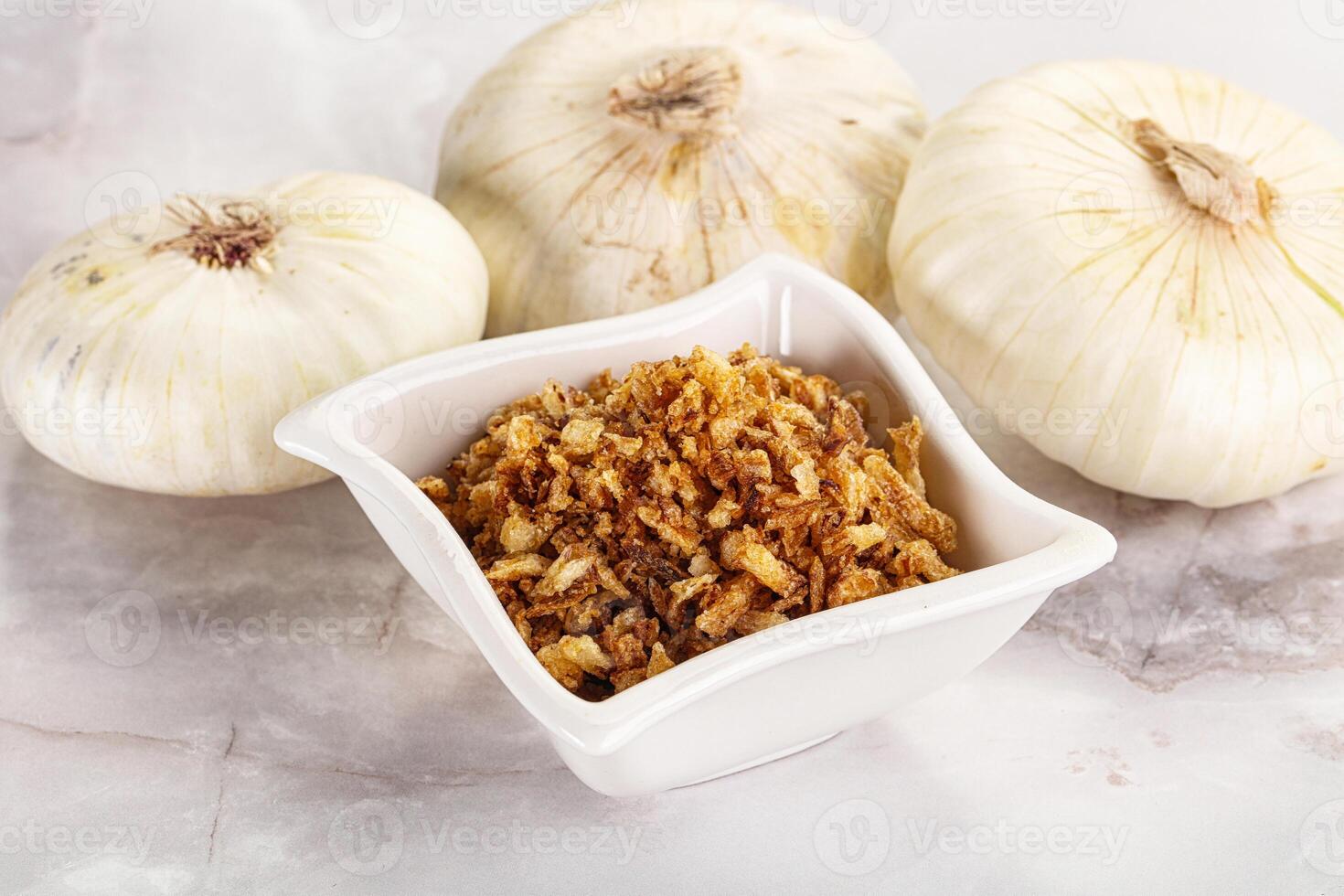 Dried roasted onion flakes for culinary photo