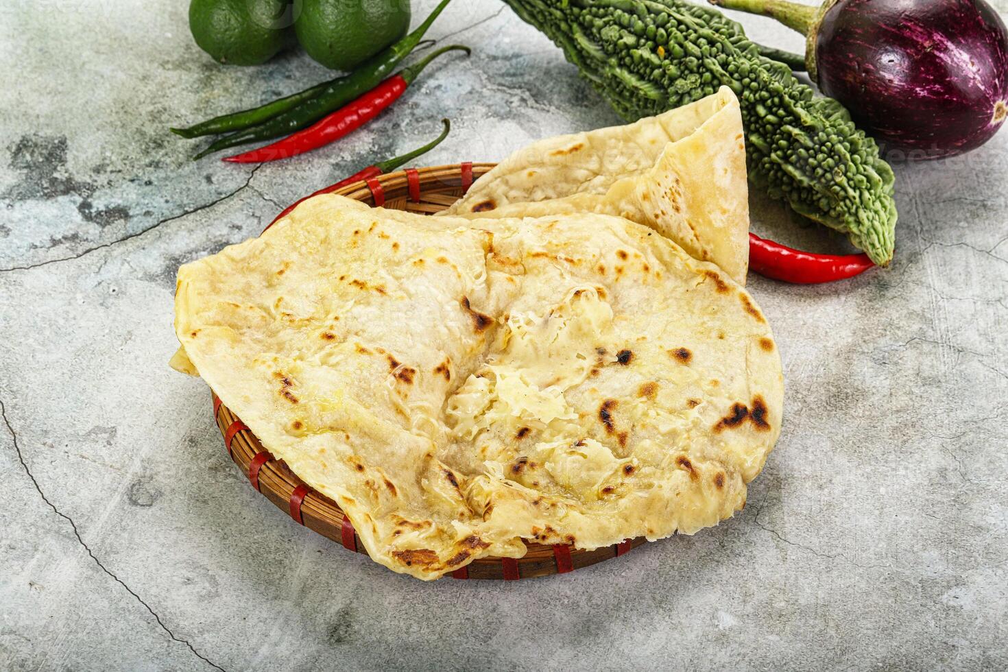 Indian tandori bread - naan with cheese photo