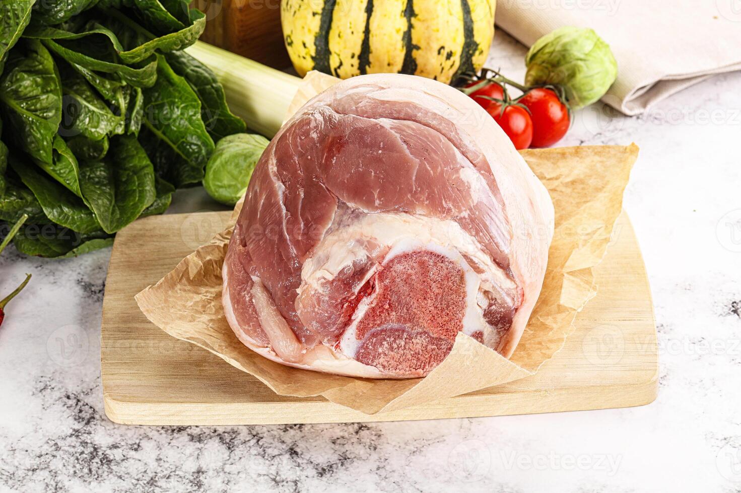 Uncooked raw pork knuckle with spices photo