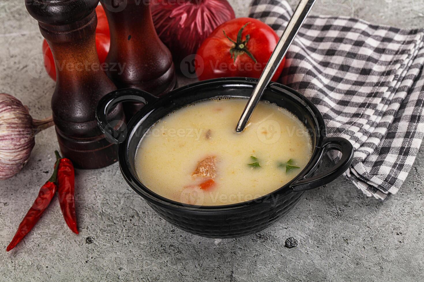Salmon cream soup with vegetables photo