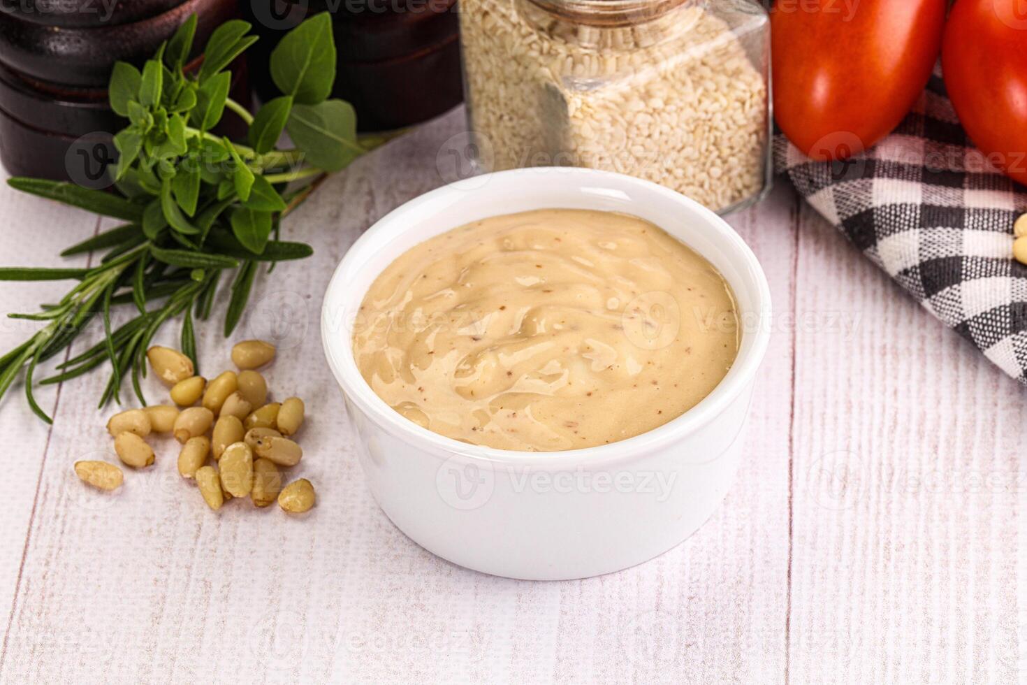 Delicious walnut creamy sauce in the bowl photo