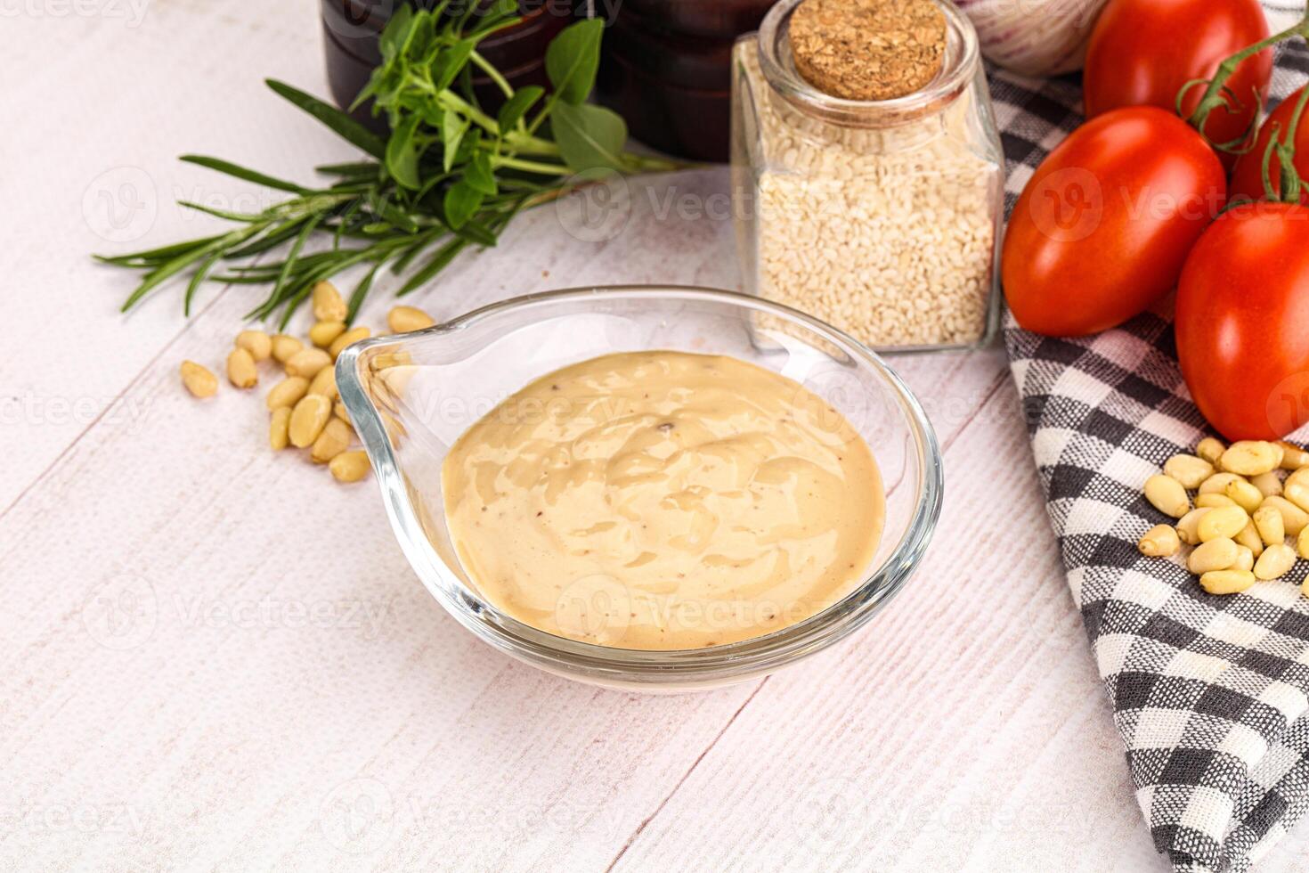 Delicious walnut creamy sauce in the bowl photo