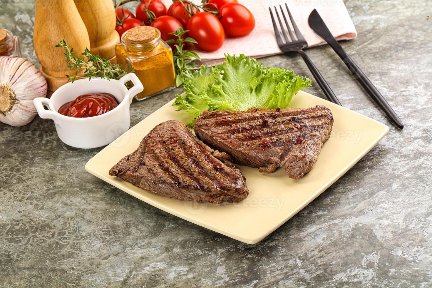 Delicus grilled beef steak with sauce photo