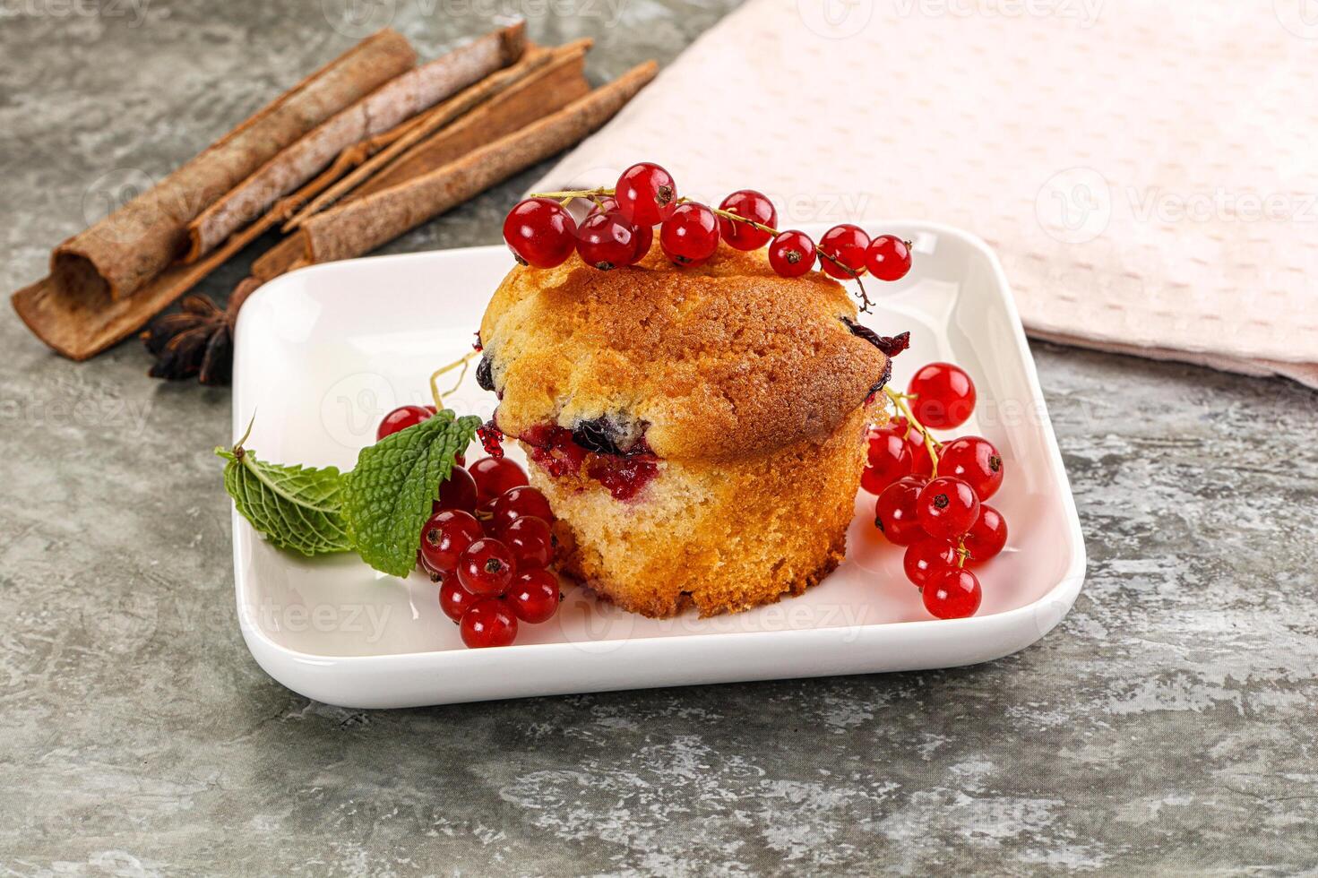 Delicous cupcake with red currant photo