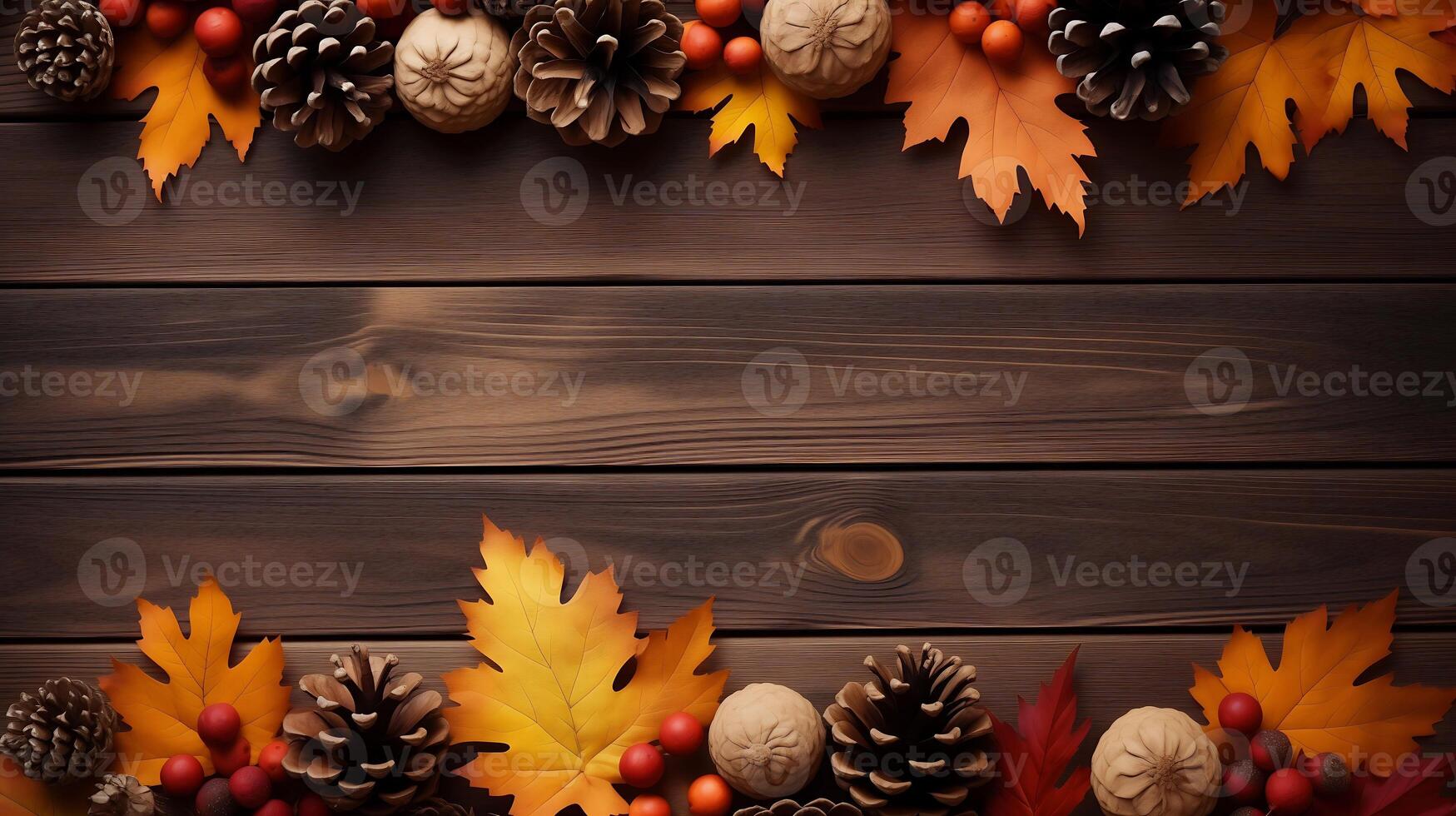 Frame of autumn maple leaves with pine cones on wooden table Background photo