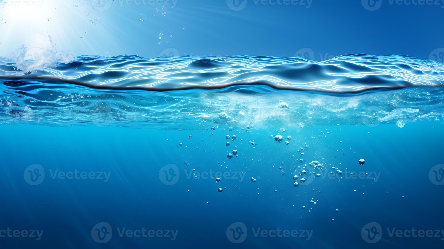 Ocean from underwater looking towards the water surface and sky Exploration concept photo