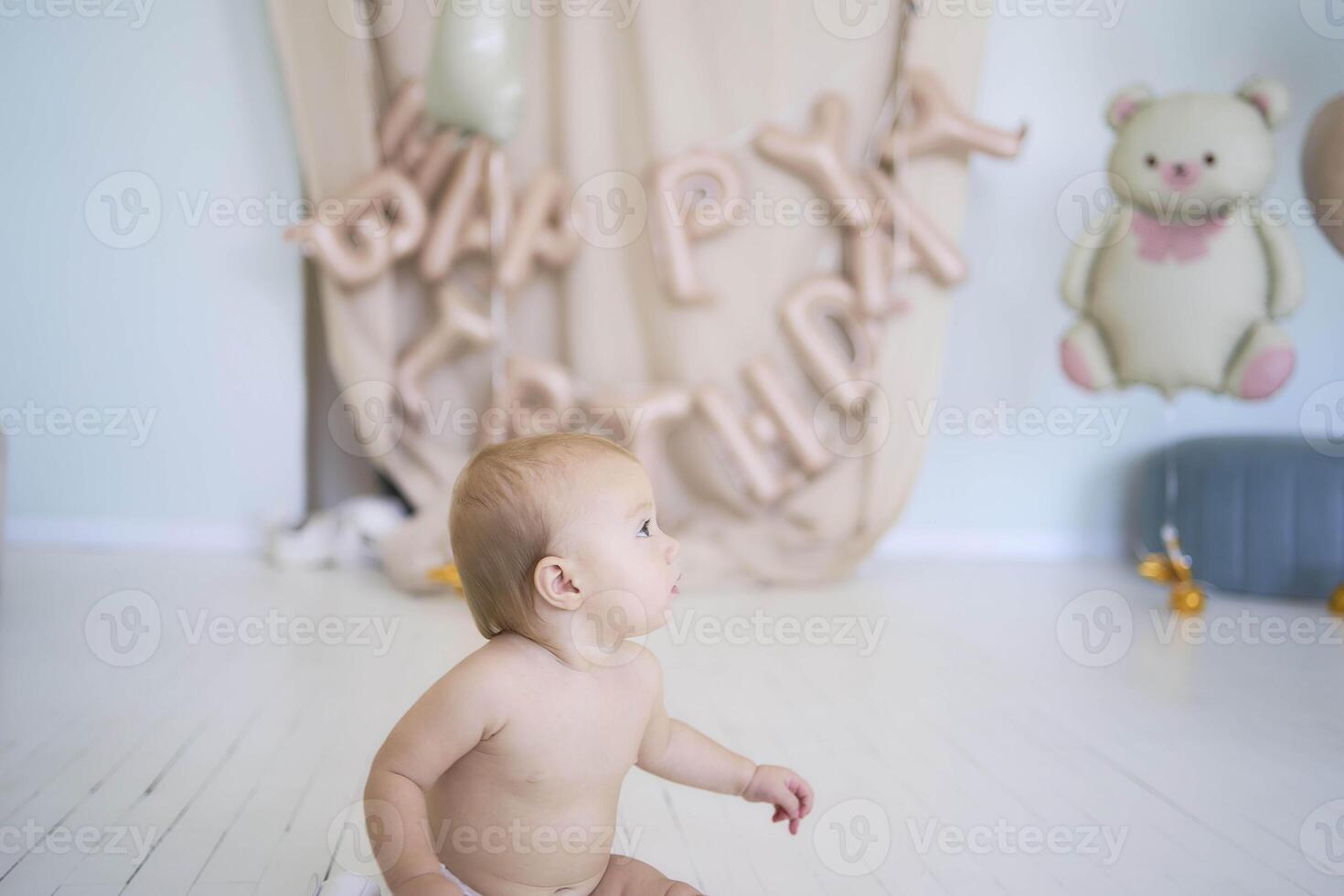 photo session on the first birthday of a baby girl, baby play with decorative rocks