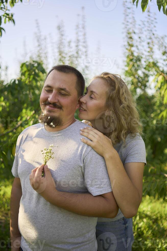 a middle-aged couple in love in the garden photo