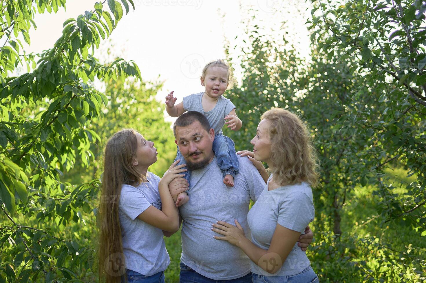 family playing with their toddler photo