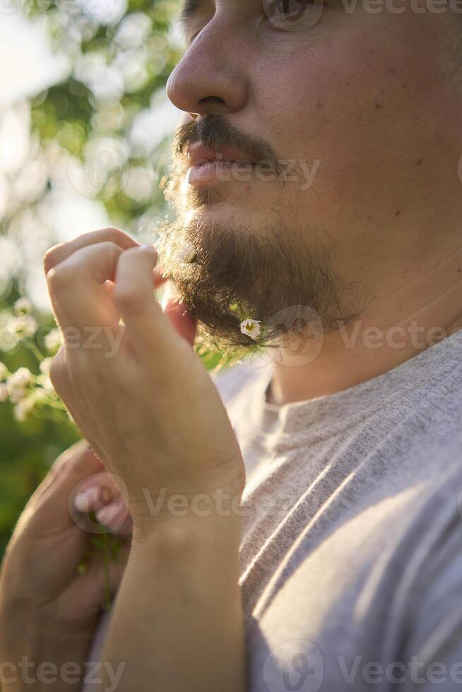 the wife weaves flowers into her husband's beard photo