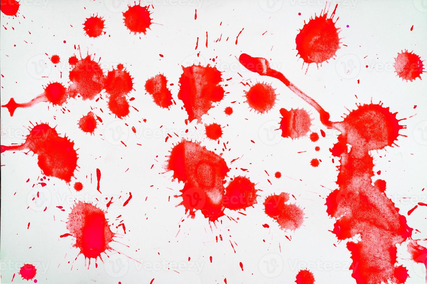 Red blots and spots on a white background. photo
