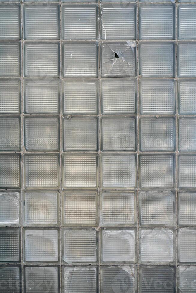 A wall of glass bricks. Building architecture decorative texture. photo