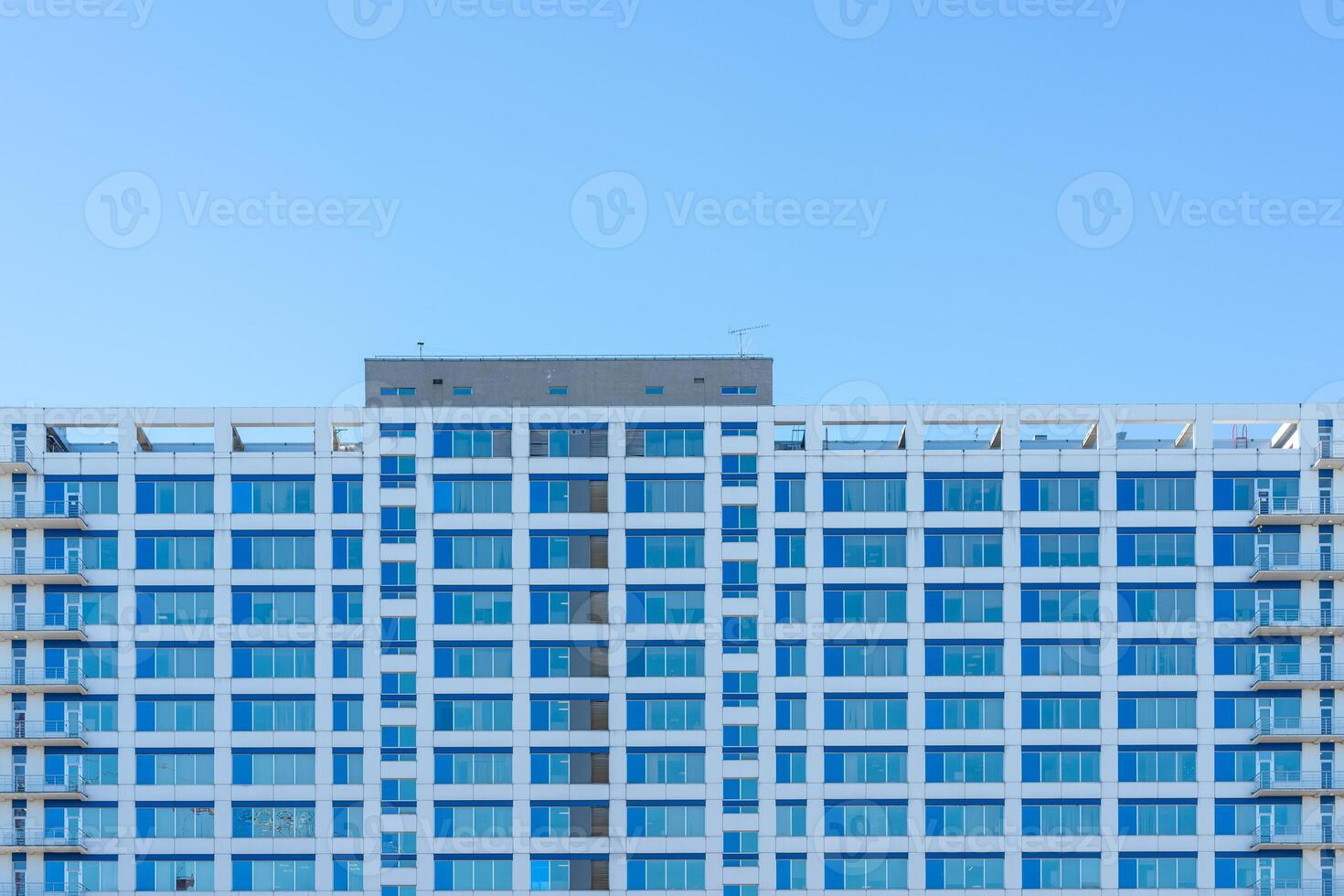 A modern glass building. Building texture in the city. photo