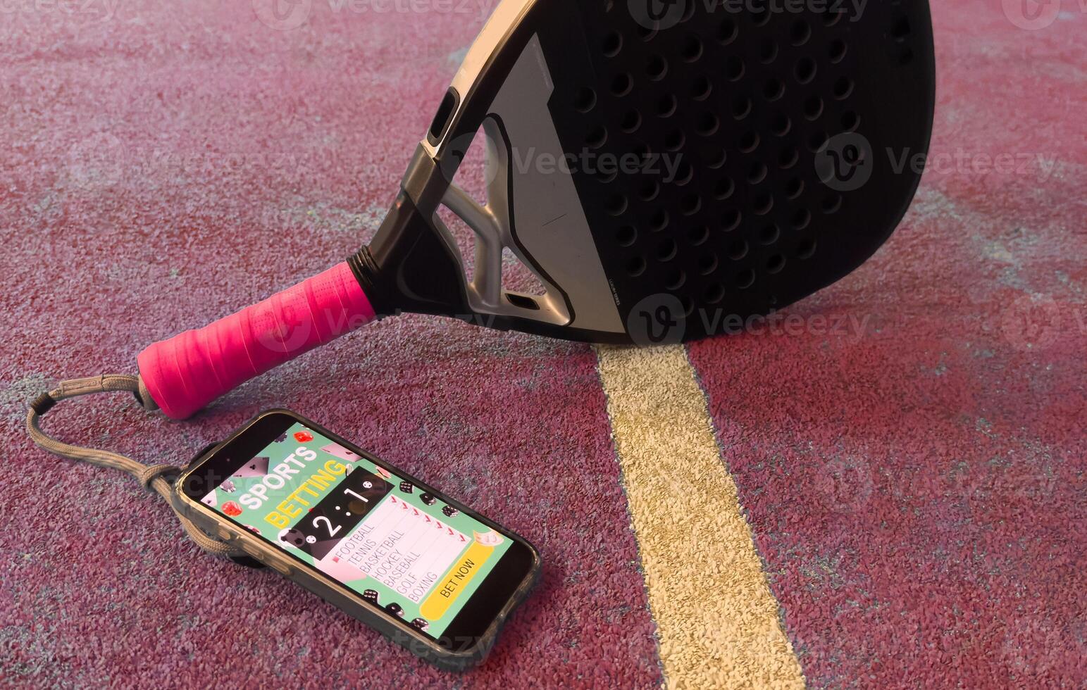 padel tennis and sports betting on a smartphone. Concept of sports bet photo