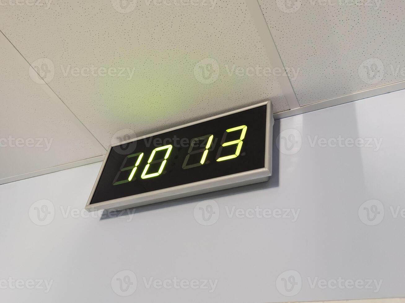 Digital clock in airport terminal. photo