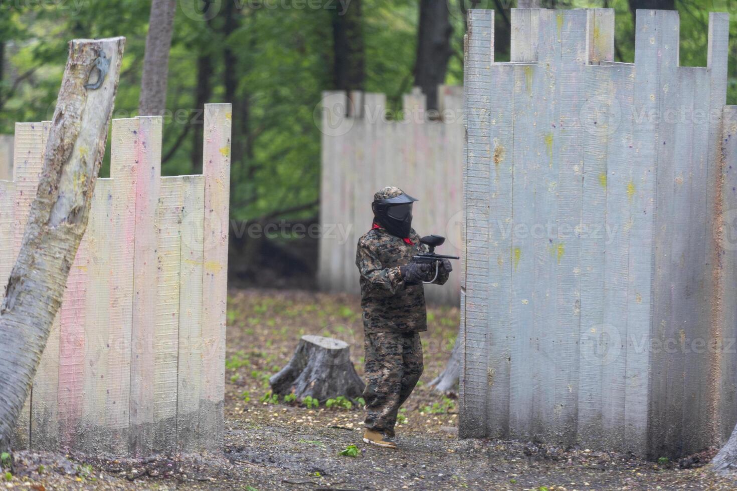 kids team play paintball on the field photo