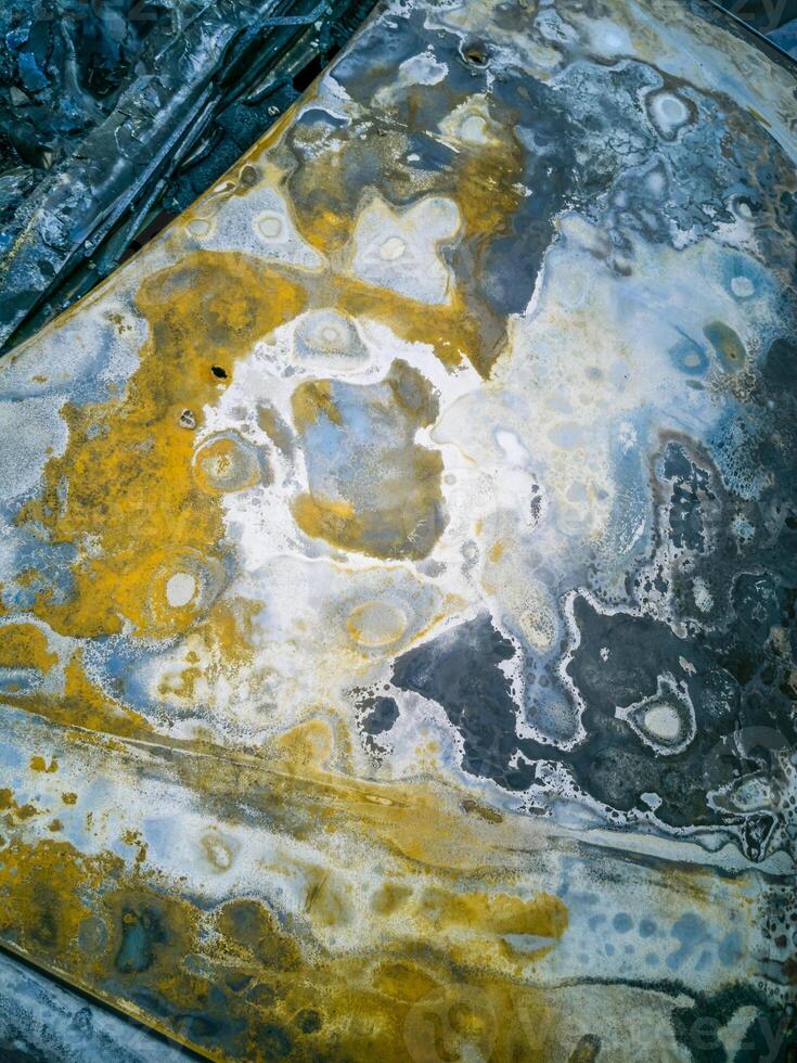 Burnt new car. burnt metal texture, metallic background. photo