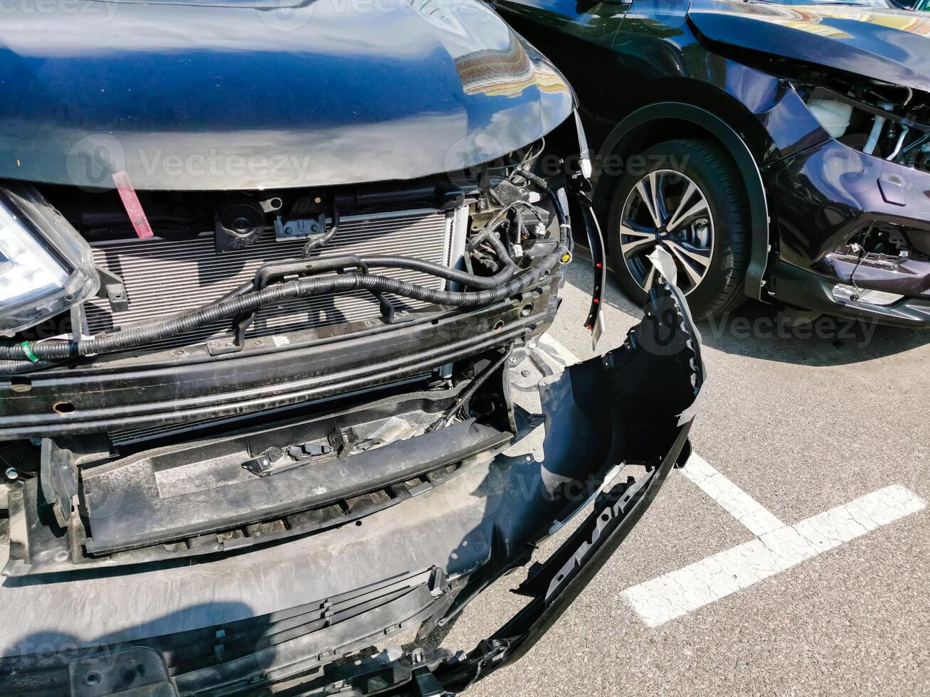 Broken and burned cars in the parking lot, accident or deliberate vandalism. Burnt car. Consequences of a car accident. Damaged by arson. Dump of civilian vehicles shot by Russian troops in Ukraine. photo
