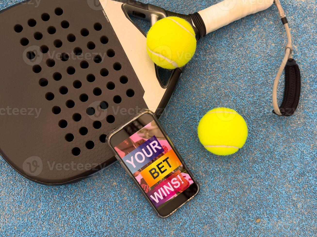 padel tennis and sports betting on a smartphone. Concept of sports bet photo