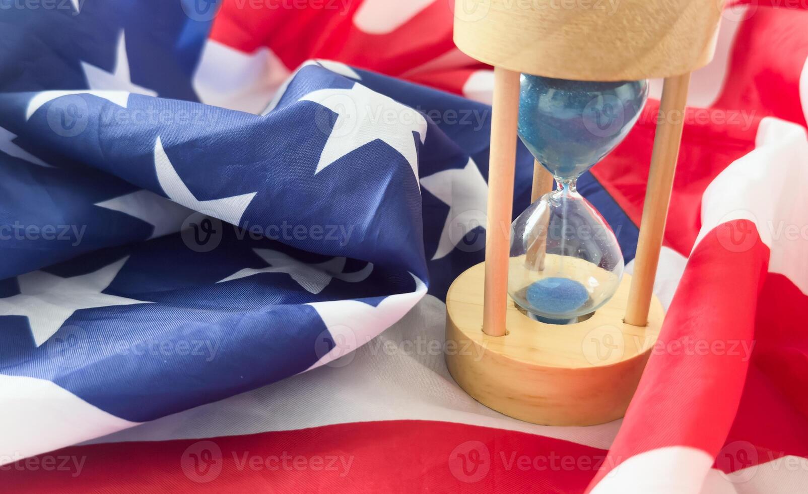 USA red white and blue flag with hour glass showing time is running out for democracy freedom and the American way photo
