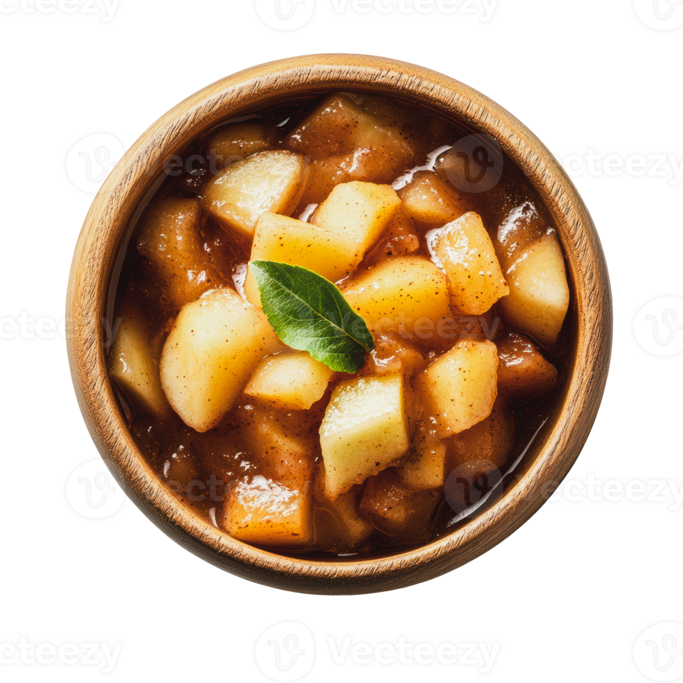 Homemade apple pie filling in a wooden bowl garnished with a fresh mint leaf png