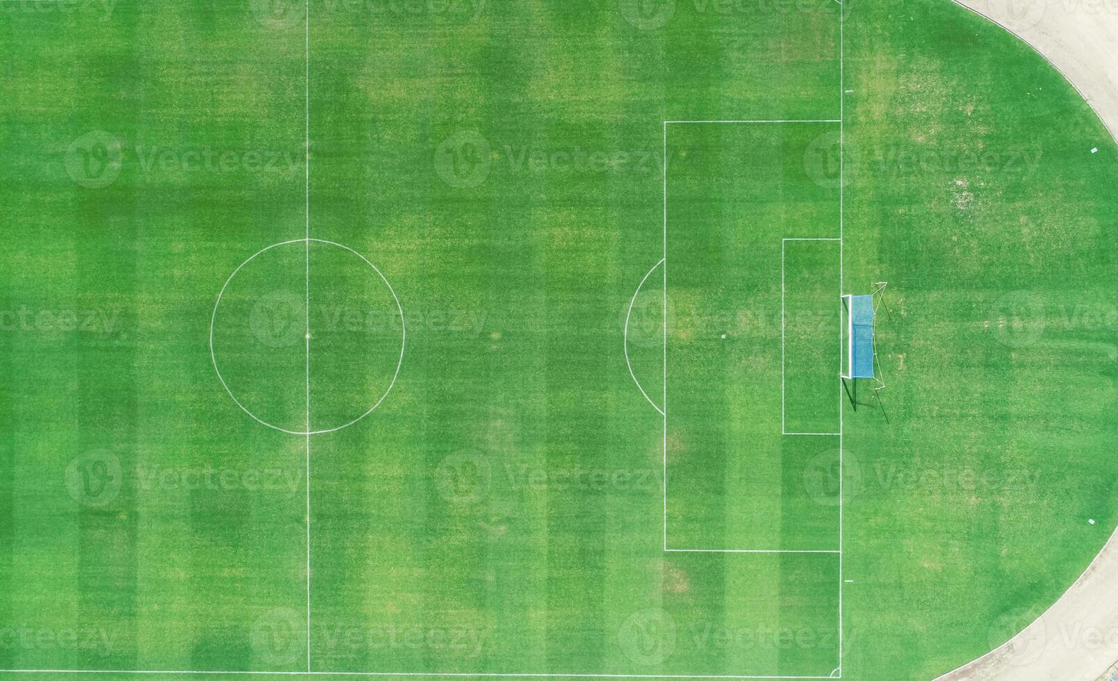 zenithal aerial view of a natural grass football field photo