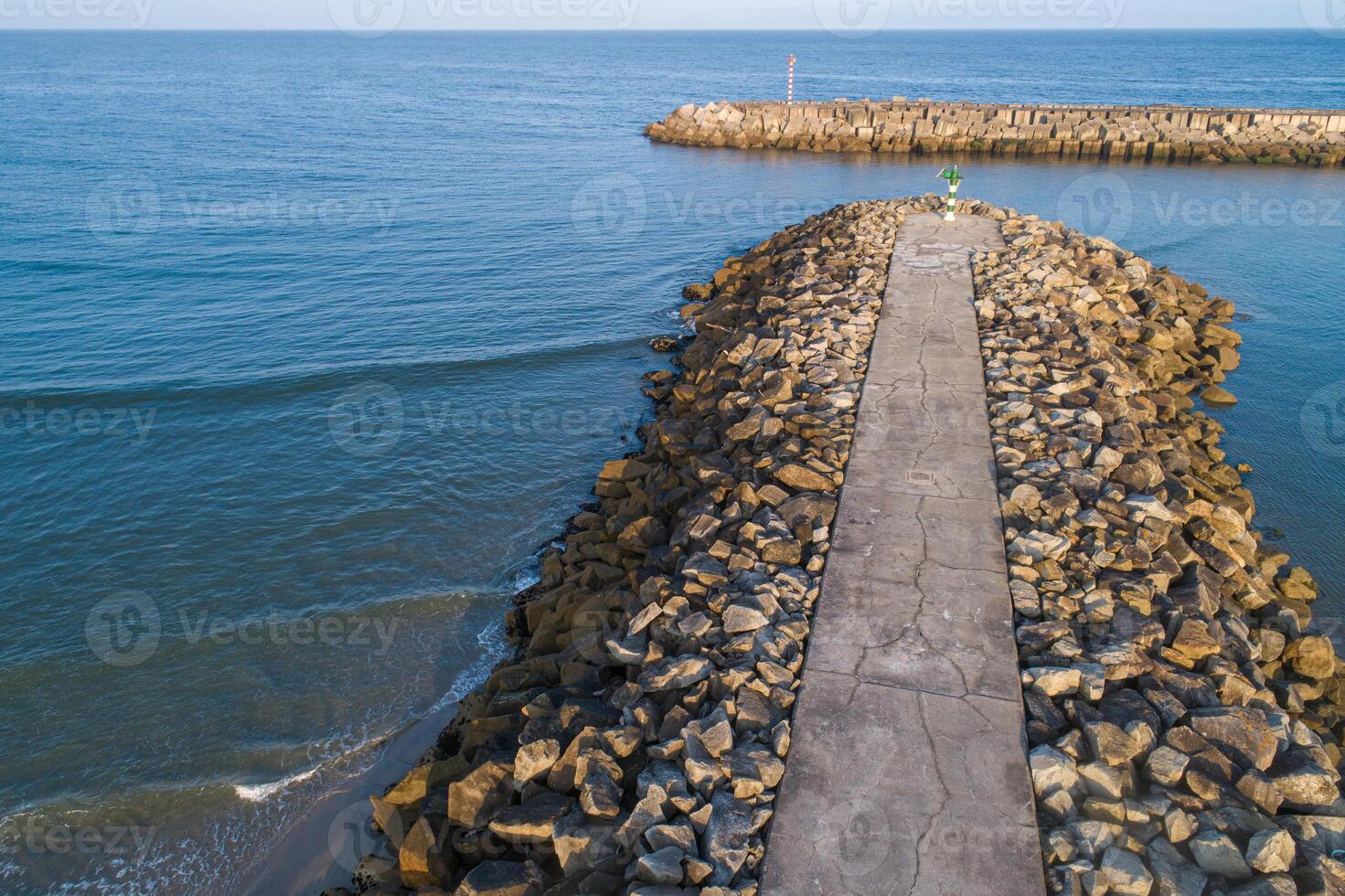 Aerial view with drone of a harbor breakwater photo