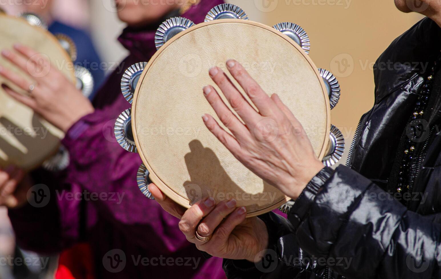 hands of a woman playing a tambourine at a Galician traditional music festival, Spain photo