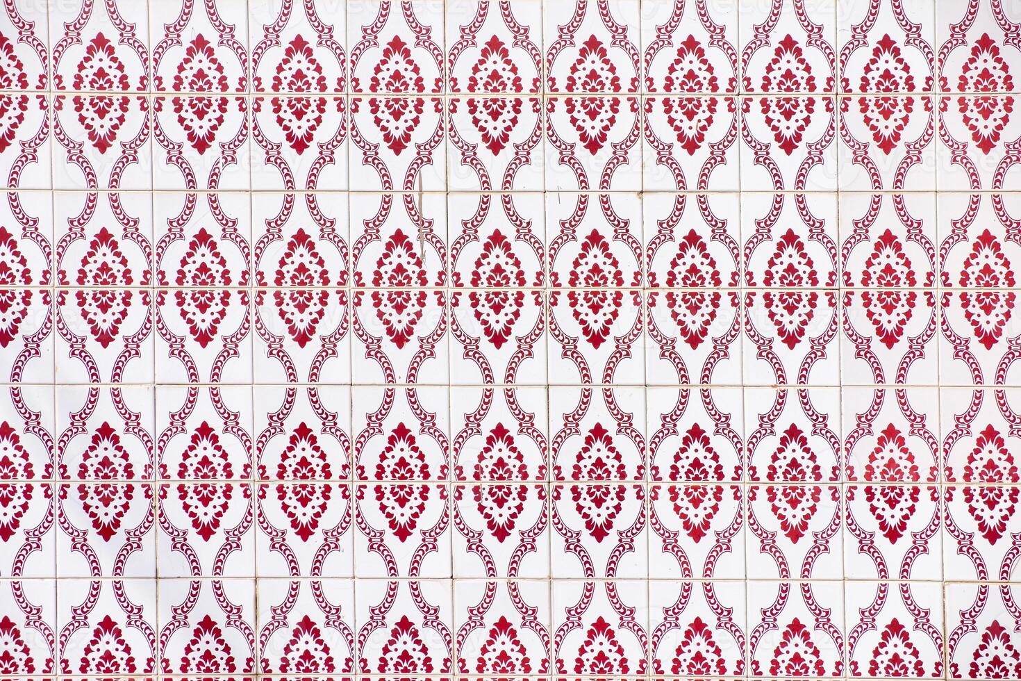 close-up view of a wall of red geometric tile shapes photo