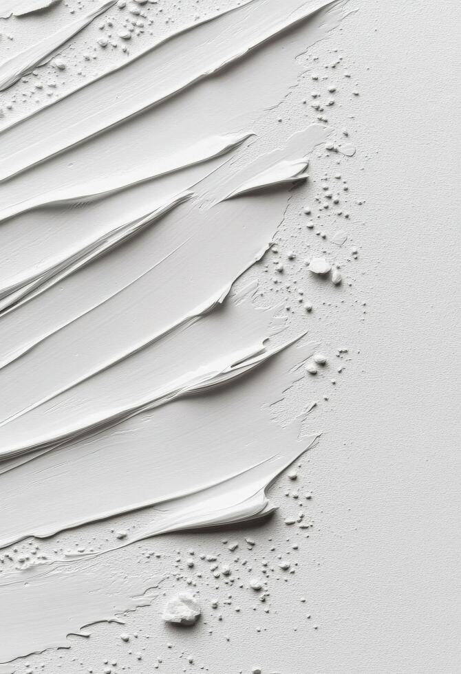 Textured white surface with paint strokes and uneven spots in natural light photo