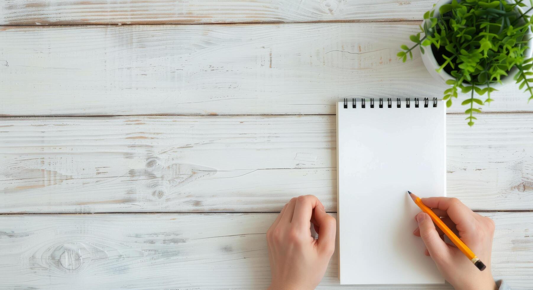 Person Writing In Notebook With Pencil Indoors During Daylight photo