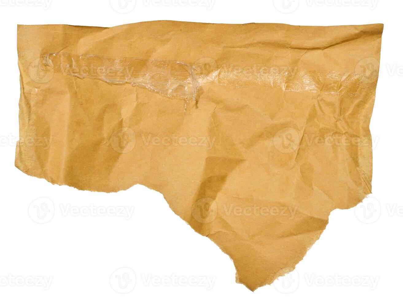 Torn piece of brown paper on a white isolated background, close up photo