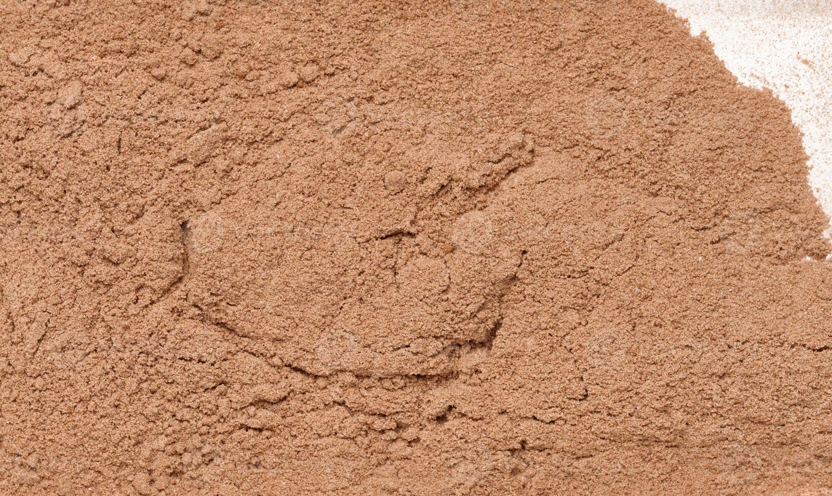 Dry ground cocoa powder, texture. photo