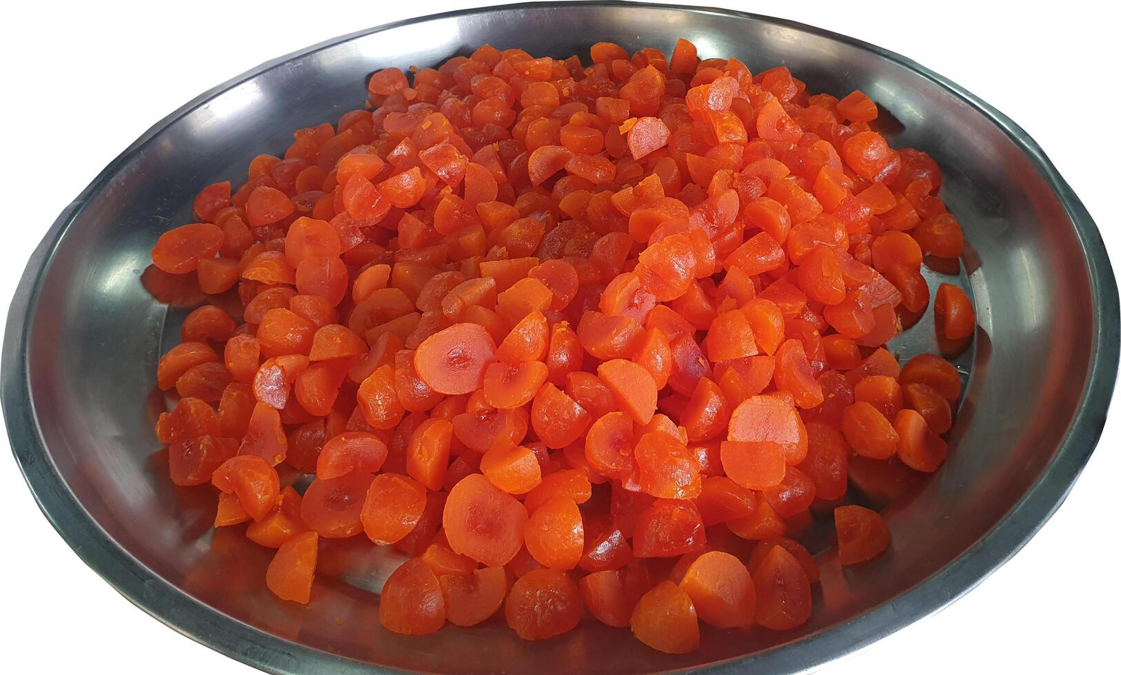 Lots of bright red halved salted egg yolks in a large stainless steel tray.new pattern, background. photo
