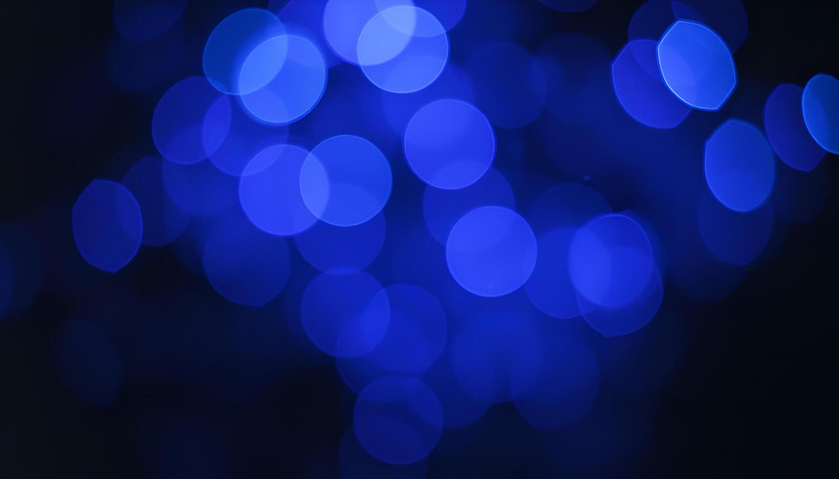 blue bokeh lights on black background photo