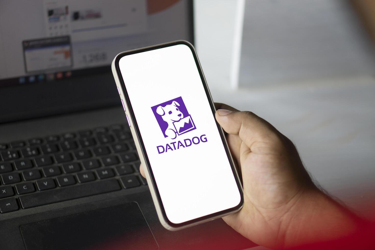 Dhaka, Bangladesh, 11 Aug 2024- DataDog logo is displayed on smartphone. Datadog is a SaaS platform that monitors cloud applications. photo