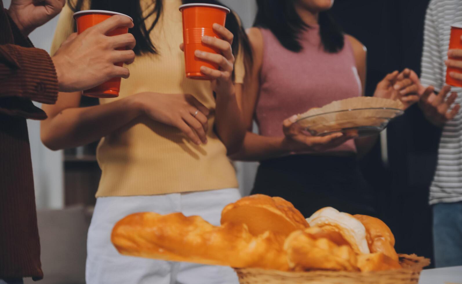 Group of young friends eating pizza.Home party. photo