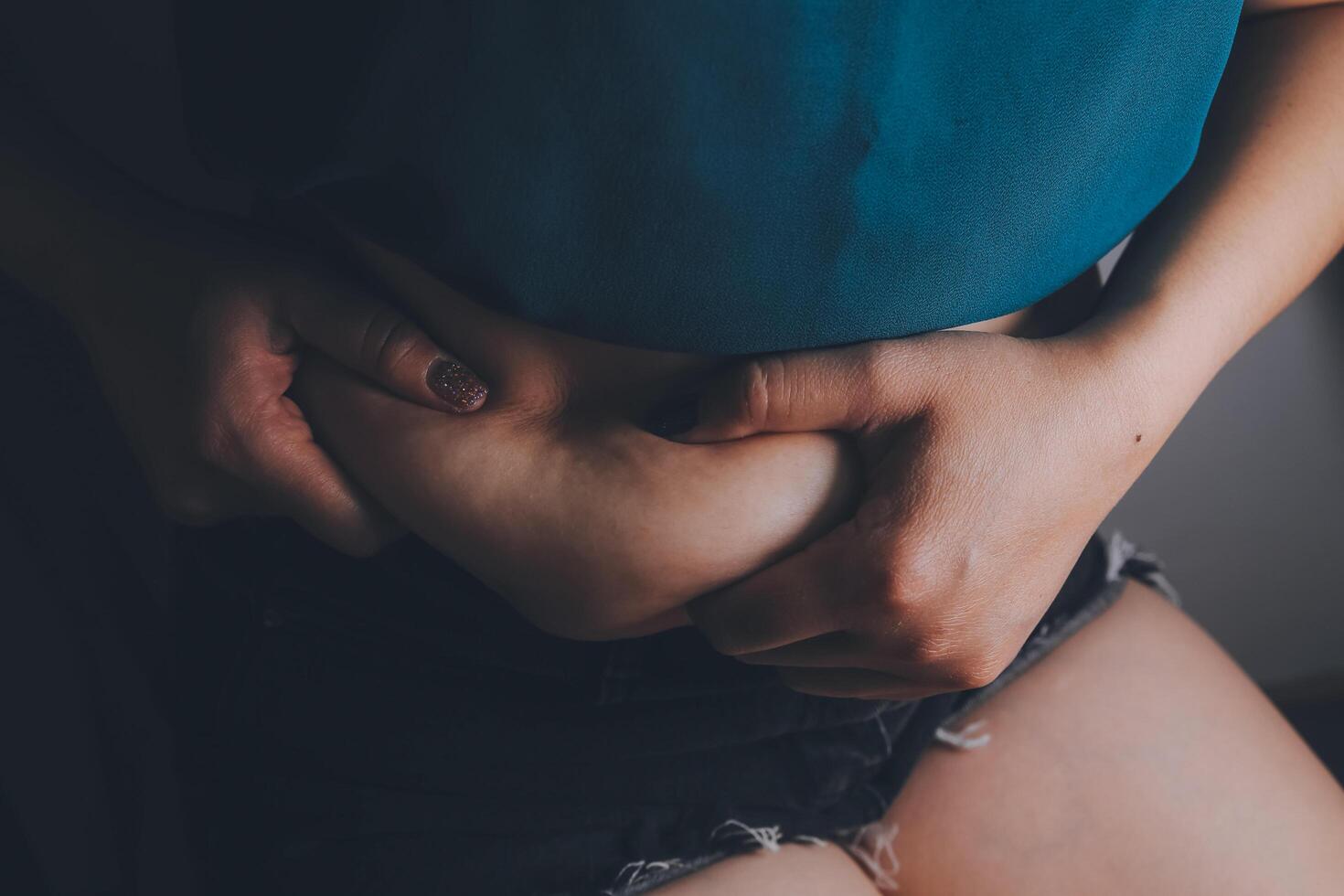 fat woman, fat belly, chubby, obese woman hand holding excessive belly fat with measure tape, woman diet lifestyle concept photo