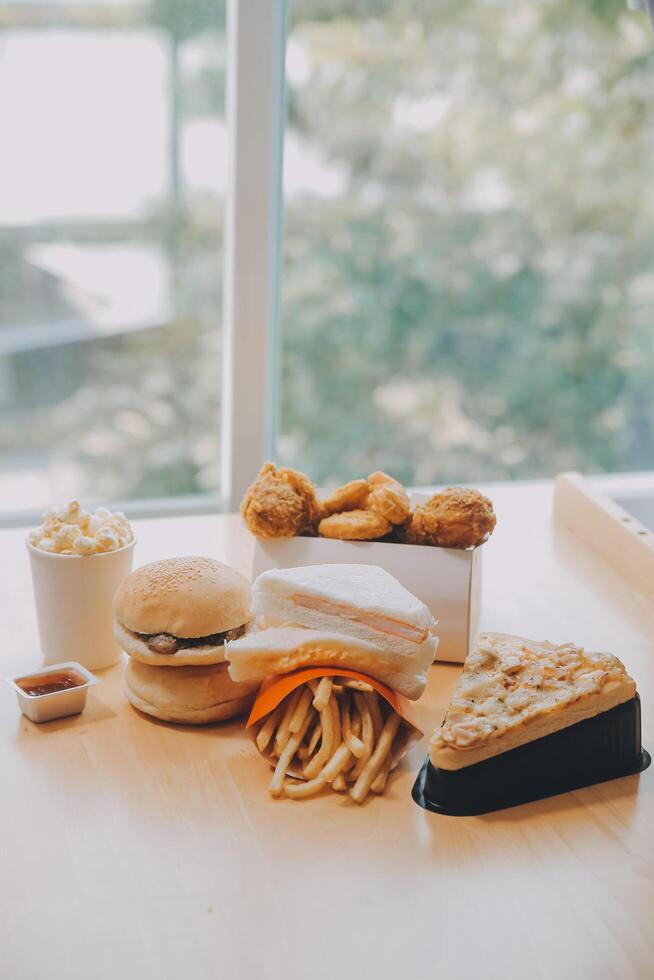 Closeup of home made burgers on wooden background photo