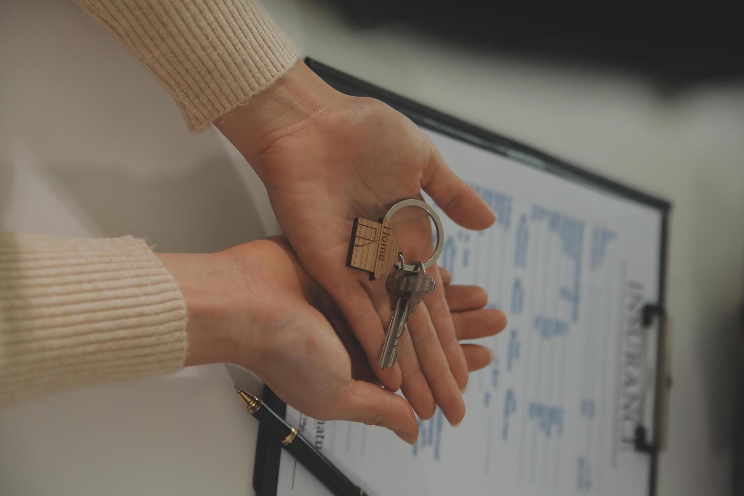 Real estate agent home sales broker is using a pen pointing to the house model and explains the business contract, rent, buy, mortgage, loan, or home insurance photo