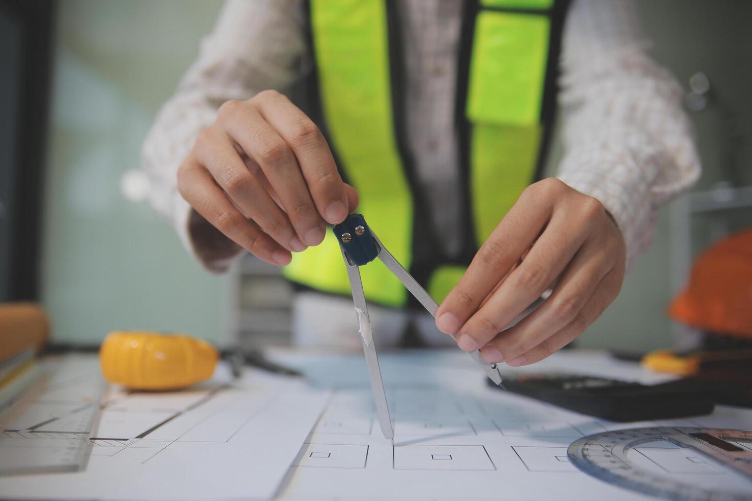 engineer people meeting working and pointing at a blueprint in office for discussing. Engineering tools and construction concept photo