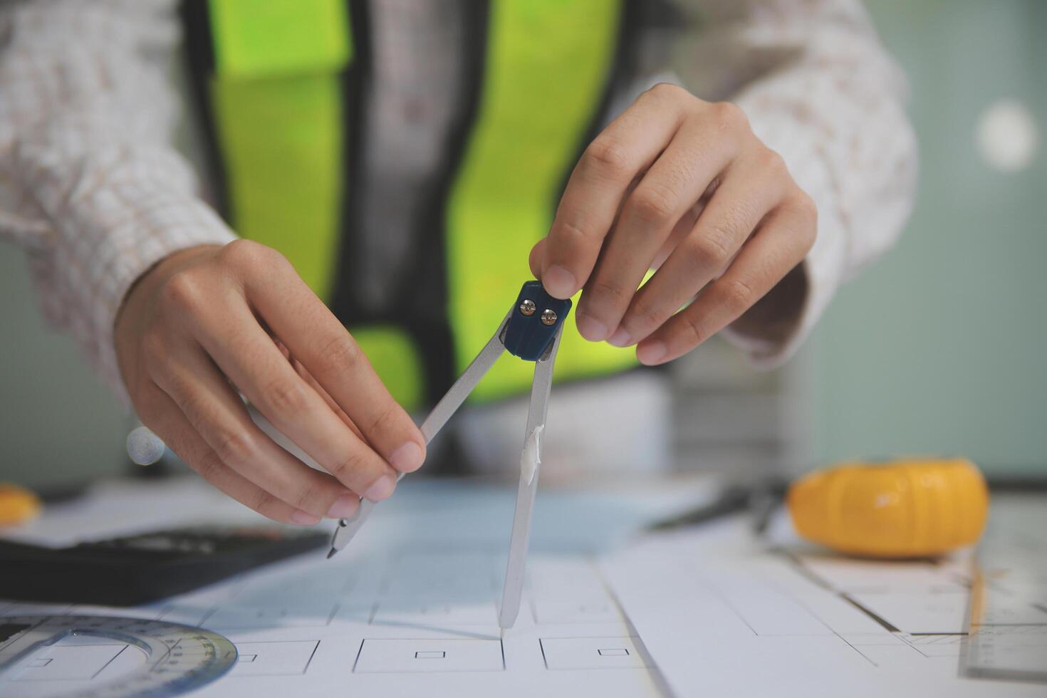 engineer people meeting working and pointing at a blueprint in office for discussing. Engineering tools and construction concept photo