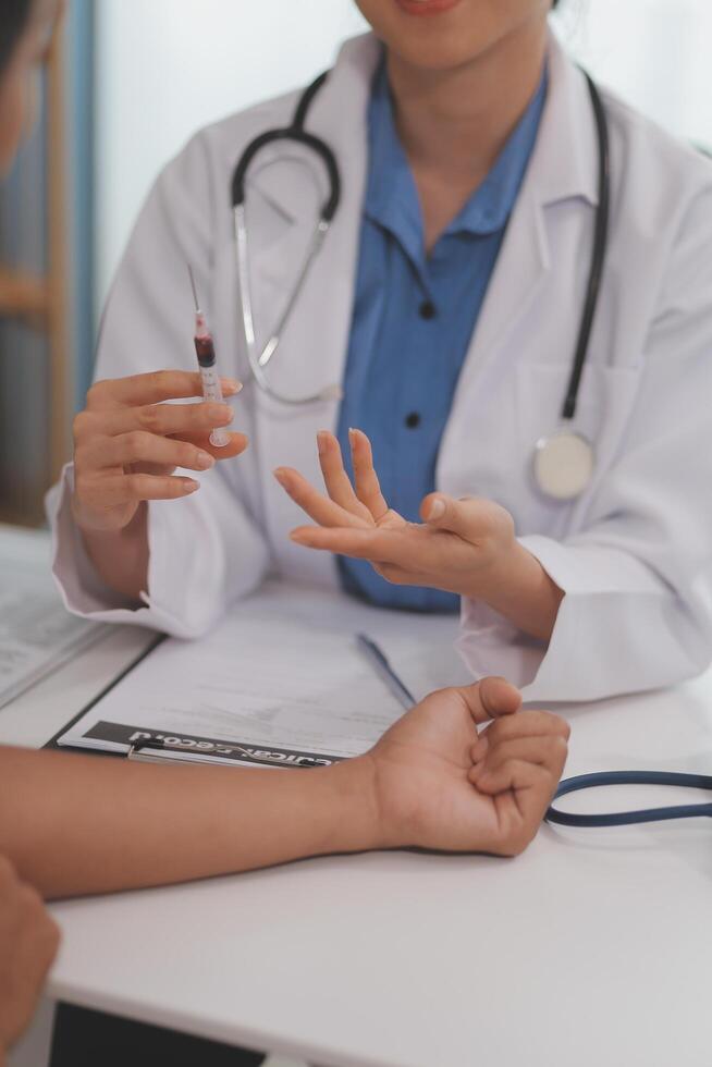 Doctor uses hypodermic needle and syringe to put a dose of medicine as treatment. photo
