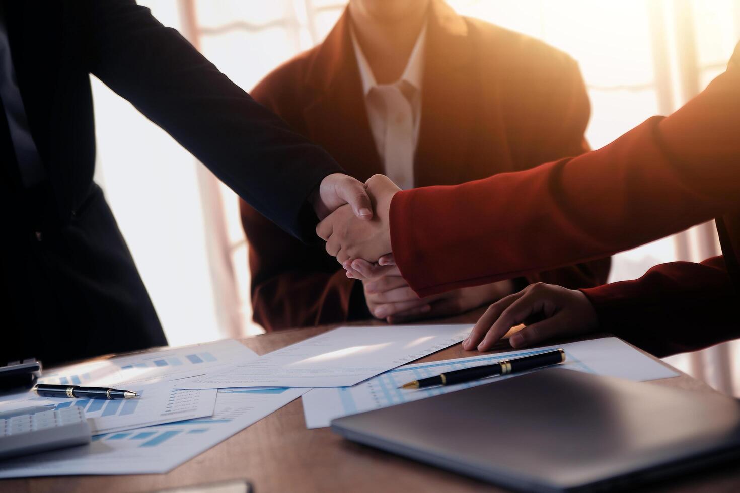 Close up of a team of business people having a meeting to analyze data for a marketing plan. photo