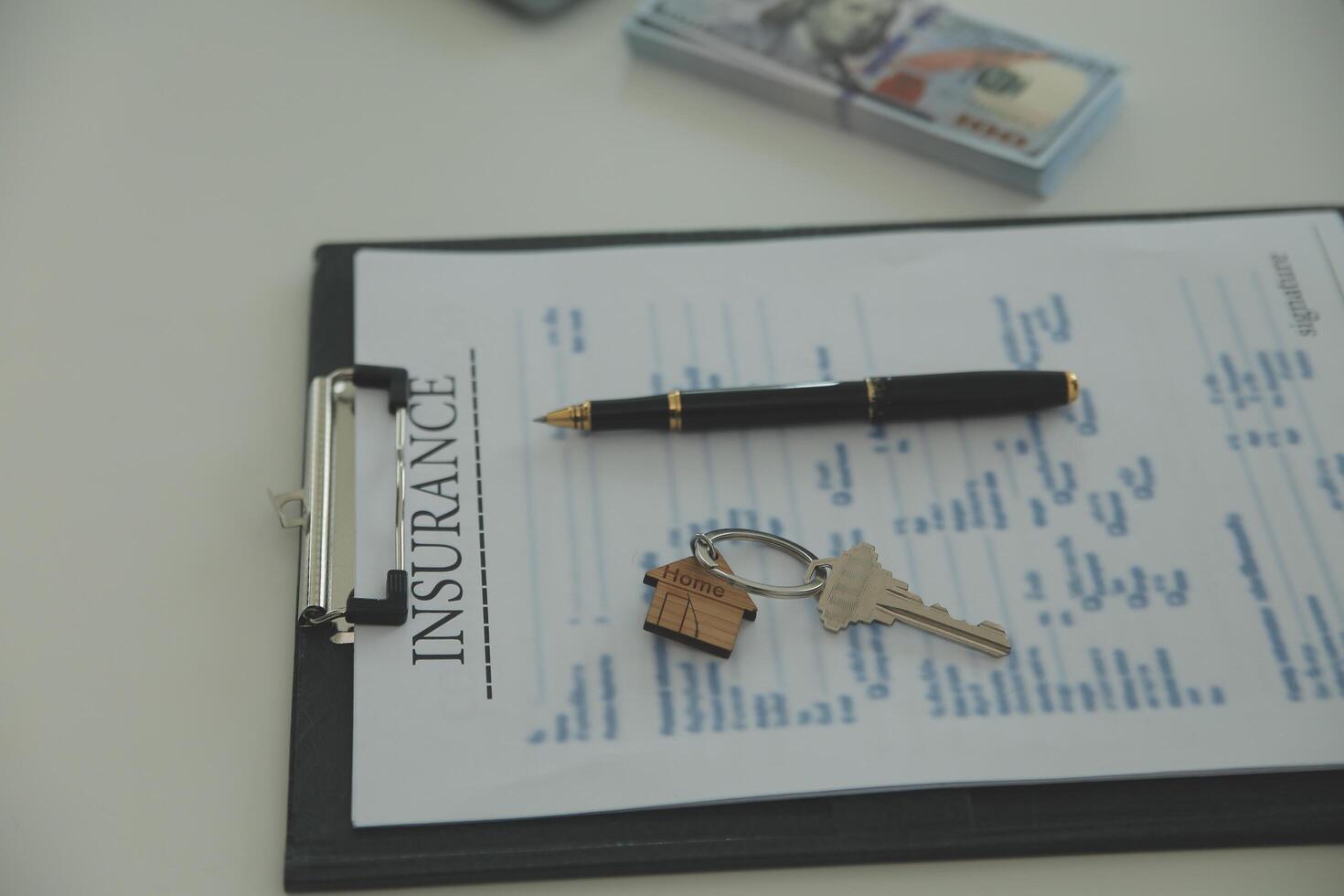 Real estate agent home sales broker is using a pen pointing to the house model and explains the business contract, rent, buy, mortgage, loan, or home insurance photo